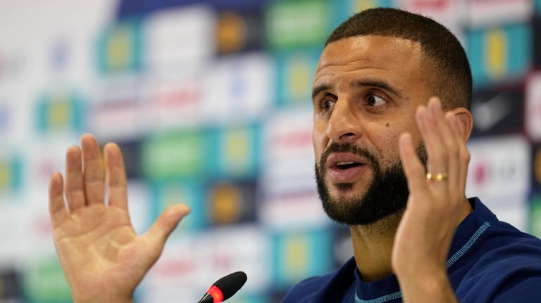 England's Kyle Walker speaks to the media during a press...