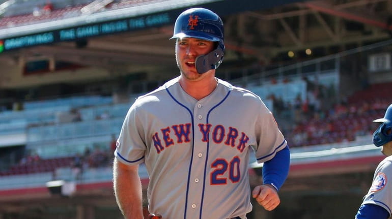 The Mets' Pete Alonso wears a smiles as he heads...