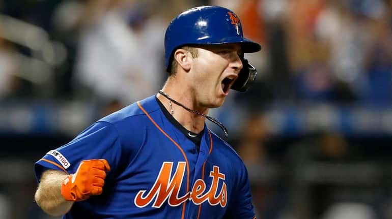 Mets first baseman Pete Alonso reacts after his seventh-inning home run...