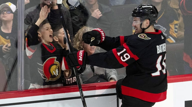 Ottawa Senators right wing Drake Batherson celebrates his game winning...