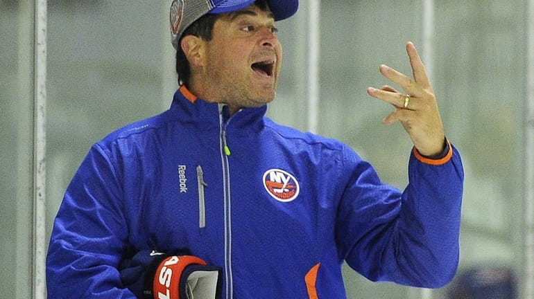 Islanders head coach Jack Capuano makes a point during training...
