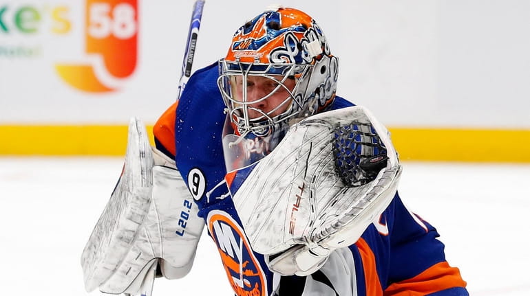 Semyon Varlamov of the Islanders makes a glove save in the second...