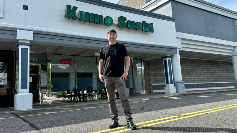 Louis Lin, owner of Kumo Sushi in Plainview, has no...
