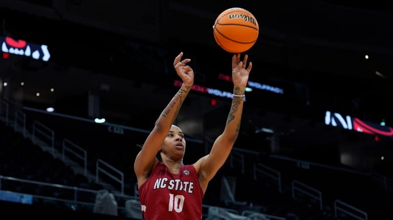 North Carolina State's Aziaha James shoots during a practice for...