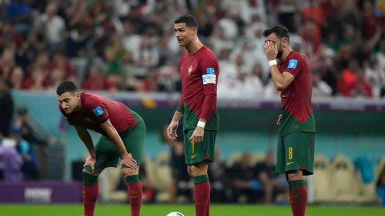 Portugal's Cristiano Ronaldo, center, stands with his teammates during the...