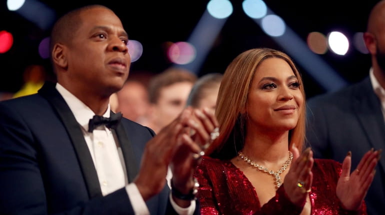 Jay-Z and Beyoncé attend the 59th Grammy Awards in Los Angeles on Feb. 12,...