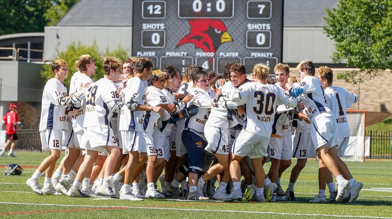 Shoreham-Wading River celebrates its victory  against Jamesville-DeWitt in the NYSPHSAA...