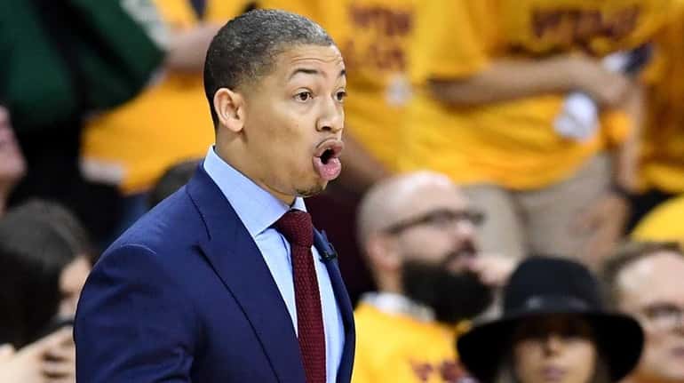 Tyronn Lue of the Cleveland Cavaliers looks on from the...
