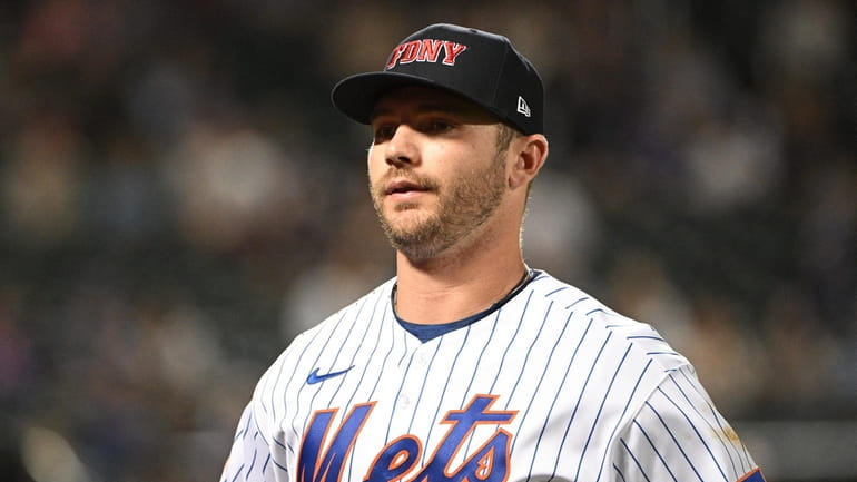 Mets first baseman Pete Alonso wears an FDNY hat during...