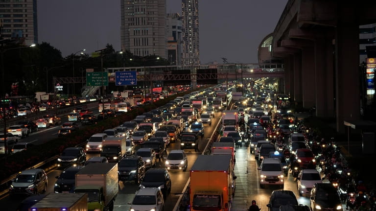 Vehicles are caught in a congestion during rush hour in...