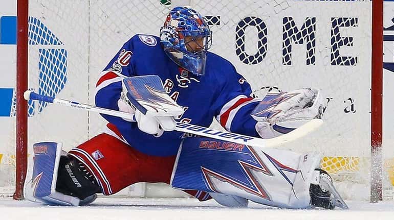 Henrik Lundqvist of the New York Rangers makes a glove...