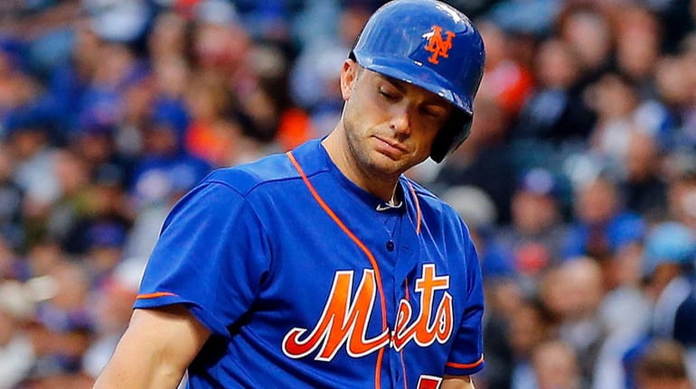 Mets third baseman David Wright strikes out in the first...