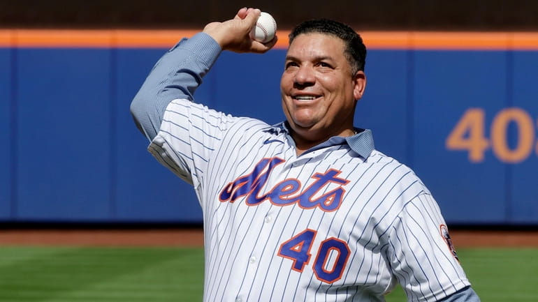 Bartolo Colon throws the ceremonial first pitch before the Mets took...