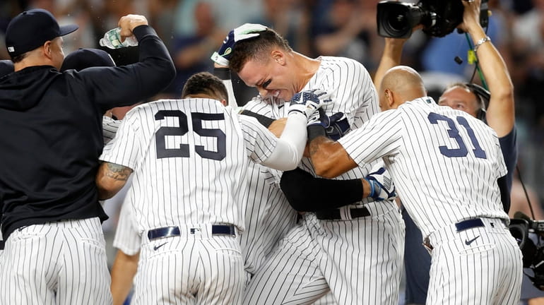 Aaron Judge of the Yankees celebrates his ninth-inning walk-off home run...