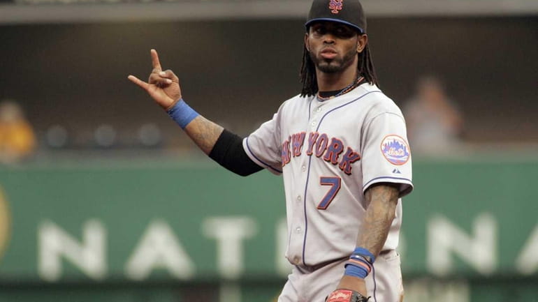 Jose Reyes of the New York Mets signals two outs...