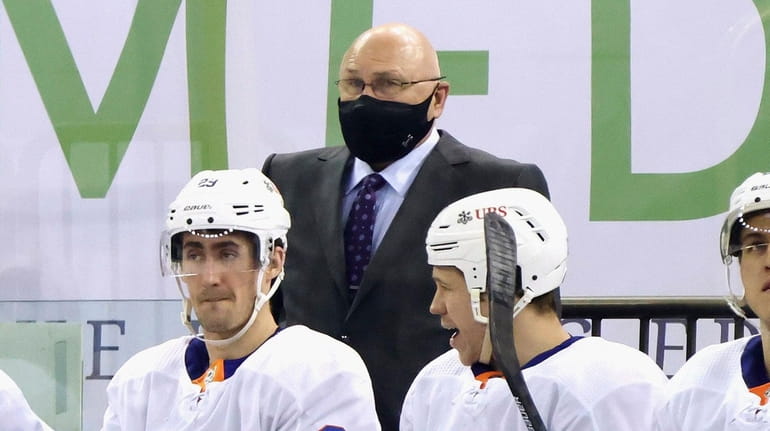Head coach Barry Trotz of the Islanders works the bench...