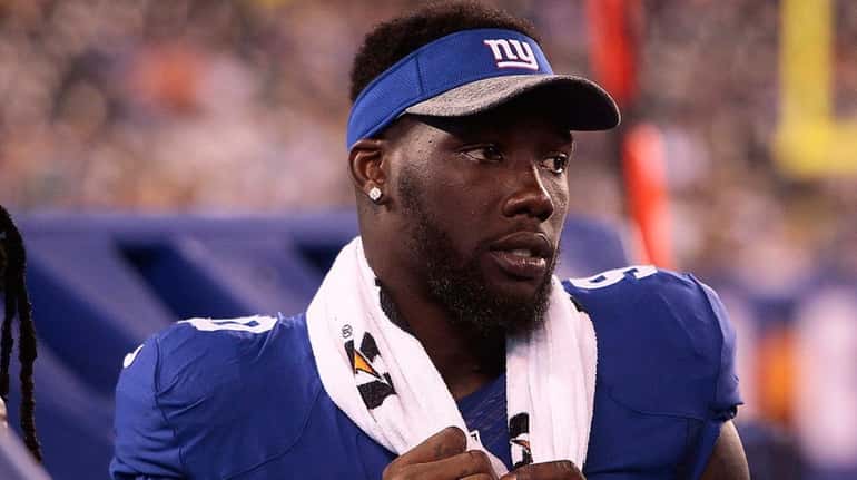 Jason Pierre-Paul of the Giants looks on from the sidelines...