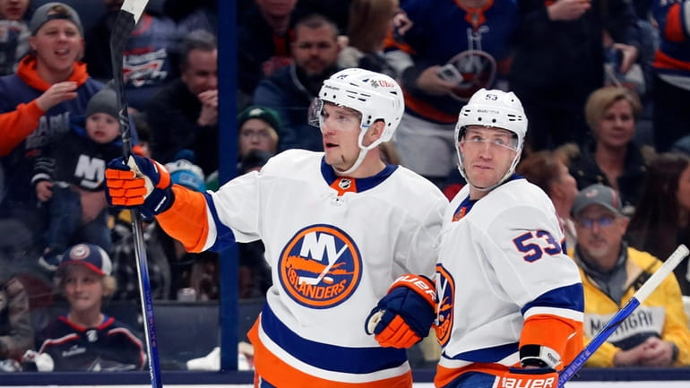 Islanders center Bo Horvat (14) celebrates a goal with teammate...