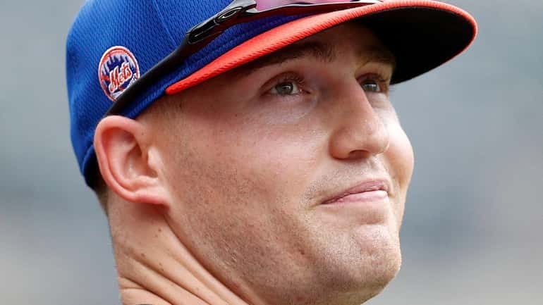 Brandon Nimmo of the Mets looks on during batting practice before a...