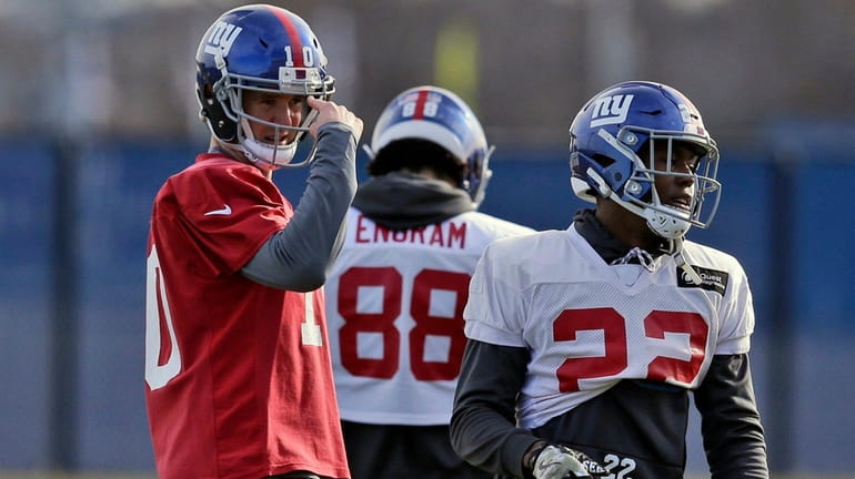 Giants quarterback Eli Manning participates in practice in East Rutherford,...