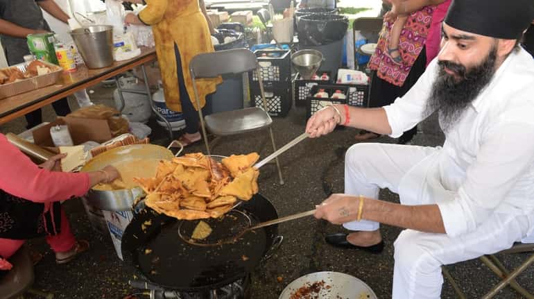 Ranjit Singh of Ozone Park cooks bread pakora during the...
