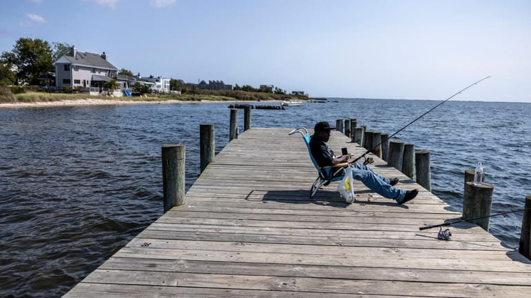 The dock at Miramar Beach extends into Patchogue Bay, offering a fine spot for...