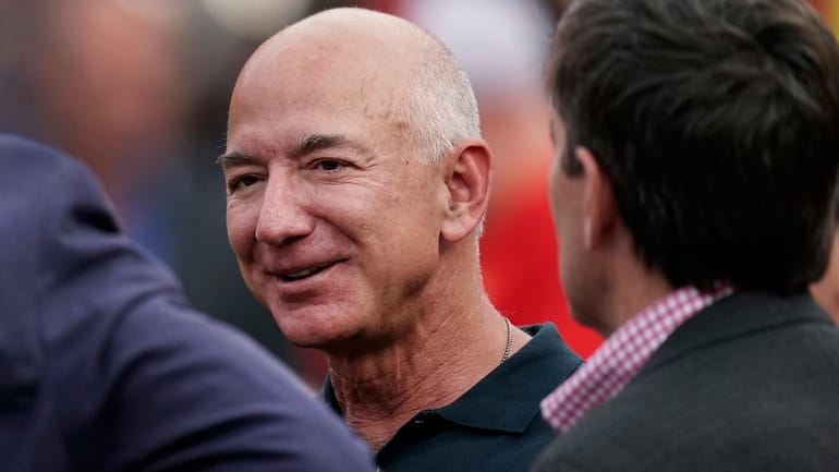 Amazon founder Jeff Bezos is seen on the sidelines before...