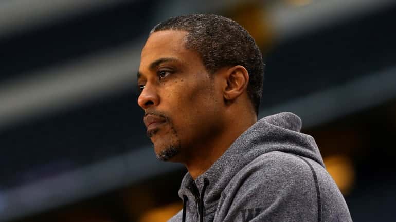 Kentucky assistant coach Rod Strickland looks on as the Wildcats practice...