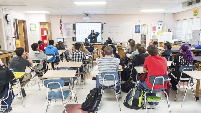 Science teacher Melissa Samuelson teaches eighth-graders in a classroom at Longwood...