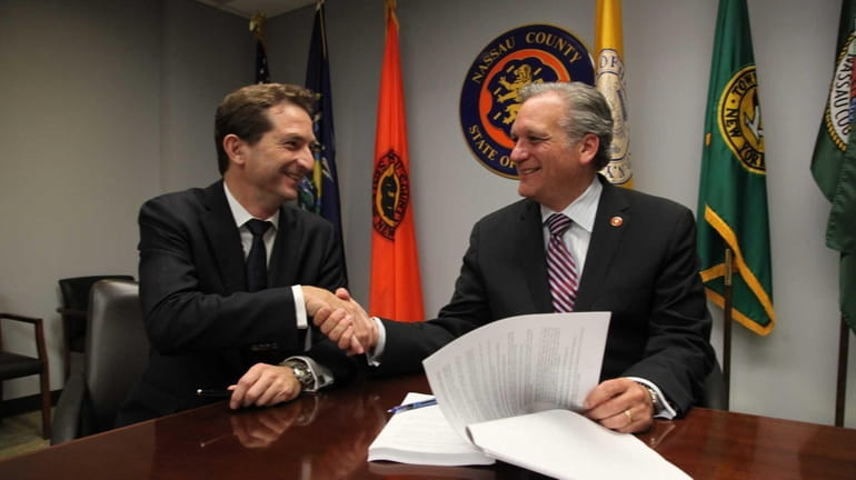 Nassau County Executive Edward Mangano with Bertrand Camus, CEO of...