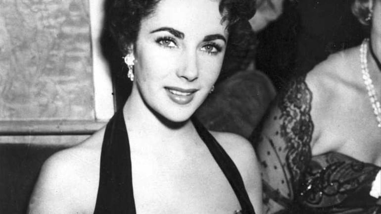 Elizabeth Taylor at a movie premiere in London in the...