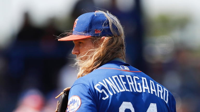 The wind blows New York Mets starting pitcher Noah Syndergaard's...