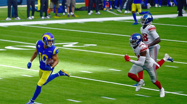 Cooper Kupp #10 of the Los Angeles Rams runs for...