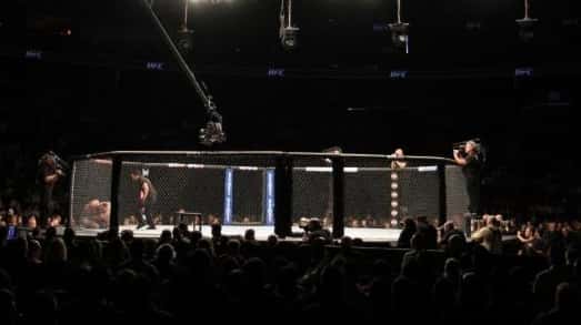 UFC fighters grapple in the the Octagon at the Prudential...