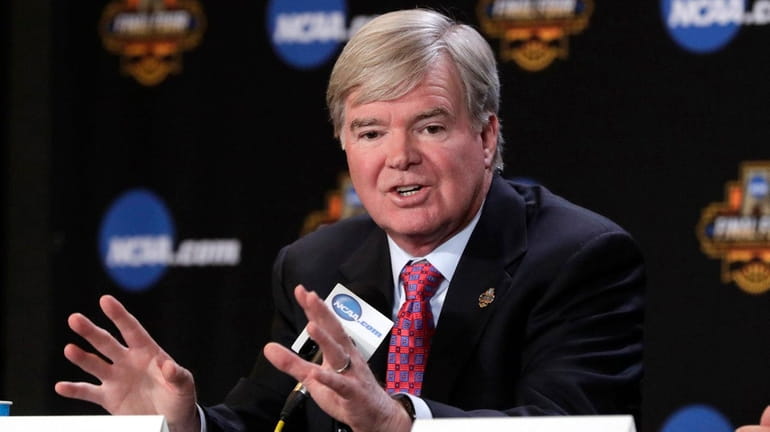 NCAA president Mark Emmert answers a question at a news...