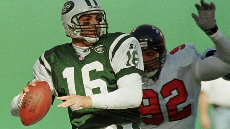 Jets quarterback Vinny Testaverde throws under pressure from Atlanta Falcons...