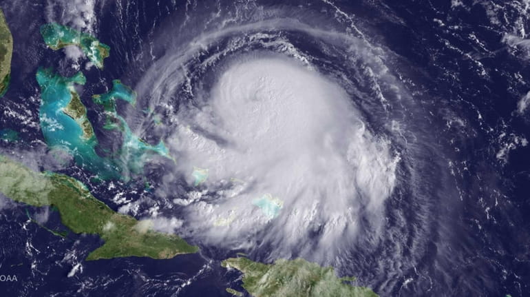 Hurricane Joaquin is seen churning in the Caribbean, Wednesday, Sept....