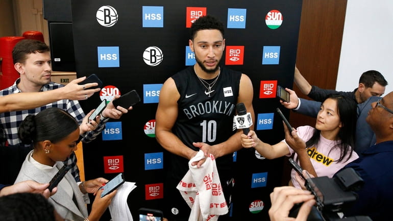 Brooklyn Nets guard Ben Simmons (10) answers questions from reporters...