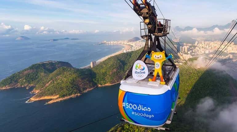Olympics mascot Vinicius rides on a Sugarloaf Mountain cable car...