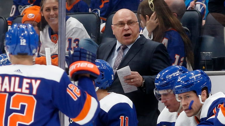 Barry Trotz looks on from the Islanders bench in the third...