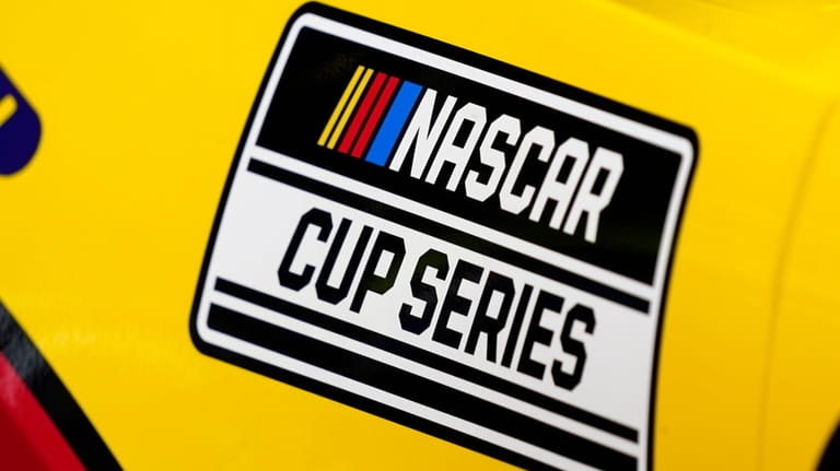 A NASCAR logo is seen on a car during auto...