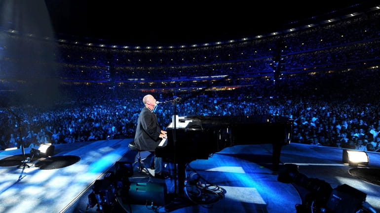 Billy Joel on stage at Shea Stadium on July 16,...