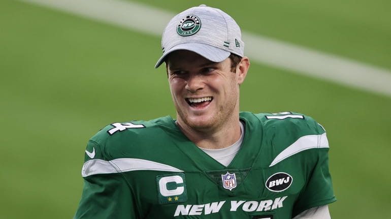 Sam Darnold #14 of the New York Jets reacts following...