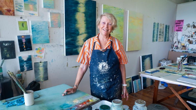 Artist Wendy Prellwitz paints in her Peconic studio, where her...