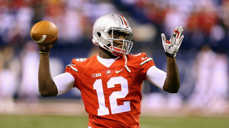 Quarterback Cardale Jones of the Ohio State Buckeyes warms up...
