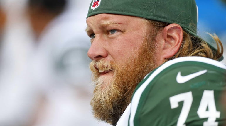 Nick Mangold #74 of the New York Jets looks on...