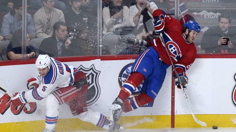 Montreal Canadiens' Brandon Prust, right, collides with Rangers' Dan Girardi...