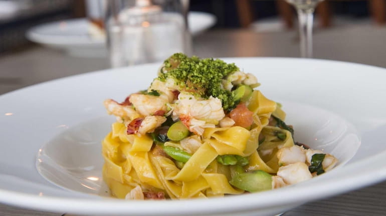 Housemade tagliatelle with lobster and asparagus is served at Scarpetta...