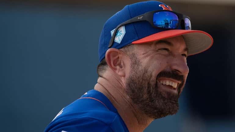 Mets manager Mickey Callaway smiles during a spring training workout...