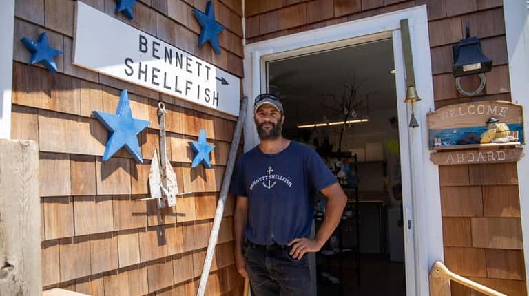 Clint Bennett at his home and garage shellfish business in...